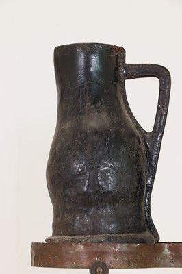 Lot 379 - Two large leather flagons or blackjacks