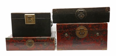 Lot 240 - A collection of four Chinese lacquered leather trunks