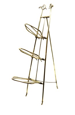 Lot 412 - An Art Nouveau brass folding three-tier stand