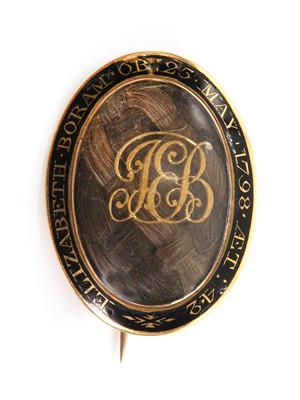 Lot 10 - A Georgian gold oval memorial brooch