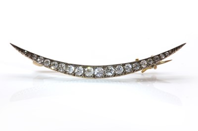 Lot 85 - A late Victorian diamond set crescent brooch, c.1900