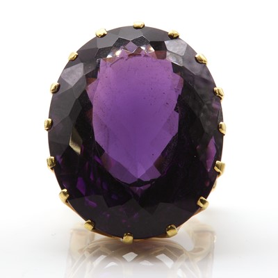 Lot 199 - An 18ct gold single stone amethyst ring with diamond set shoulders, c.1970