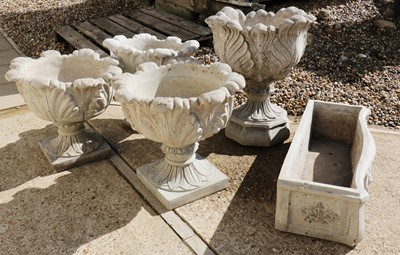 Lot 525 - A set of three composite planters
