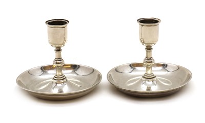 Lot 12 - A pair of Victorian silver 'Brighton Bun' travelling candlesticks