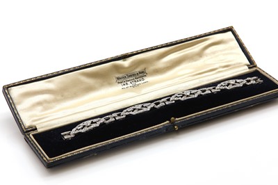 Lot 40 - A cased Art Deco diamond set plaque bracelet, c.1925