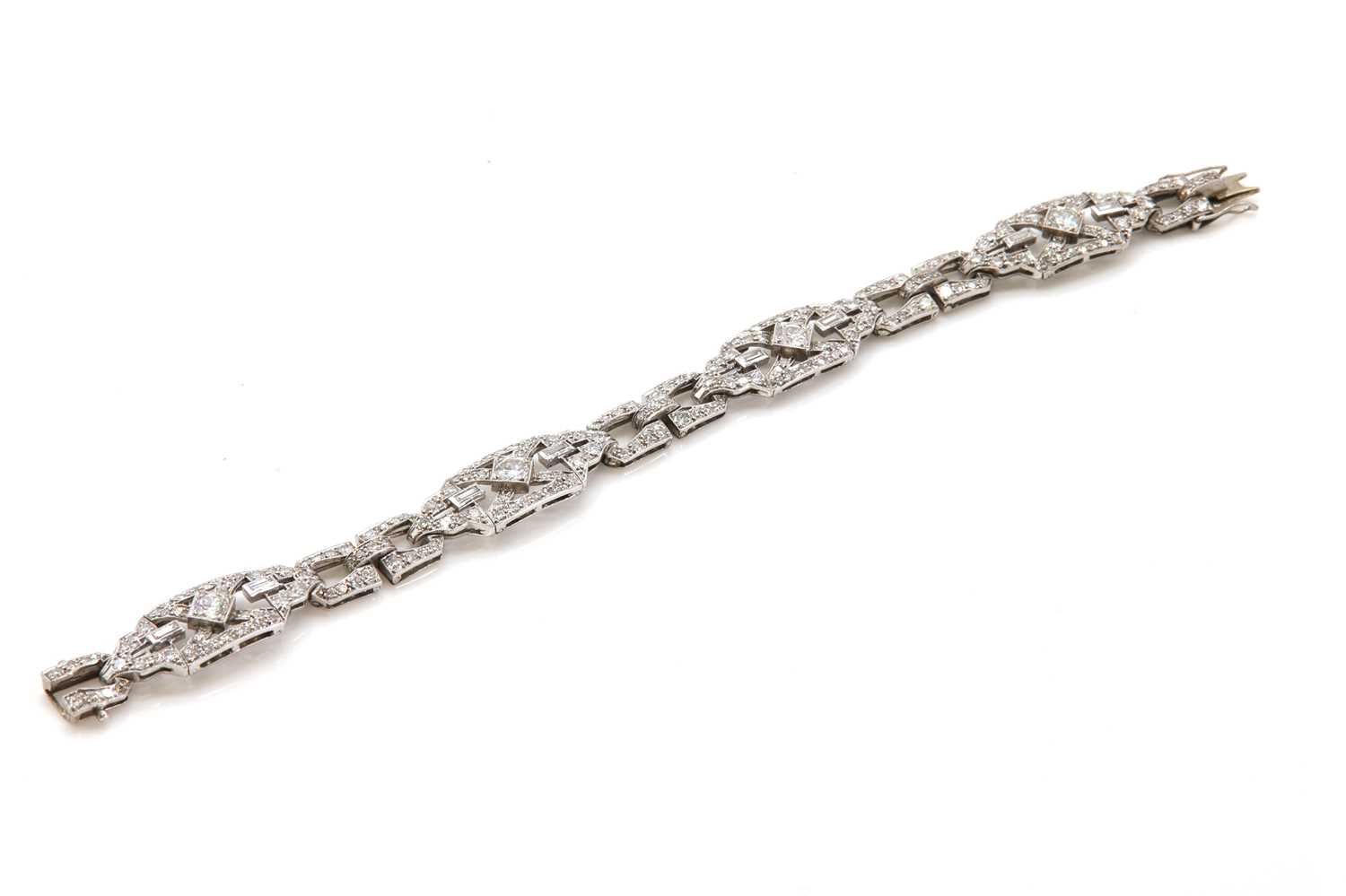 Lot 40 - A cased Art Deco diamond set plaque bracelet, c.1925