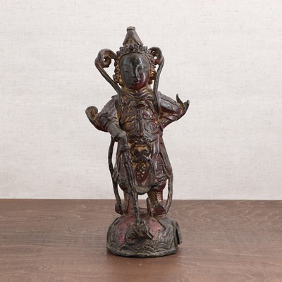 Lot 417 - A Chinese gilt-lacquered bronze figure