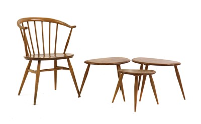 Lot 320 - A group of three Ercol elm and beech 'Pebble' tables