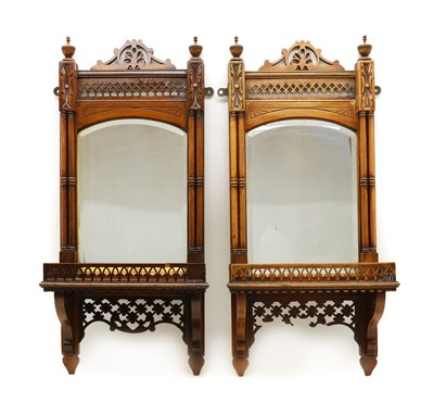 Lot 356 - A pair of Edwardian walnut wall mirrors