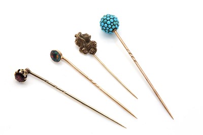 Lot 36 - An Edwardian single stone black opal stick pin