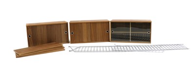 Lot 298 - A walnut 'String' shelving system