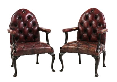 Lot 412 - A pair of mahogany Gothic Revival-style leather armchairs
