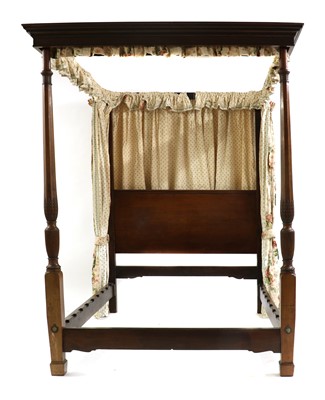 Lot 443 - A mahogany four poster bed