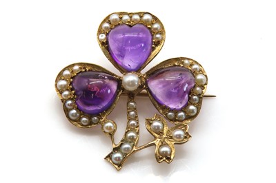 Lot 99 - A late Victorian amethyst and split pearl shamrock brooch, c.1900