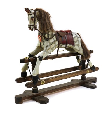 Lot 427 - A large dappled rocking horse