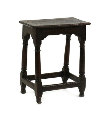 Lot 433 - An oak joint stool