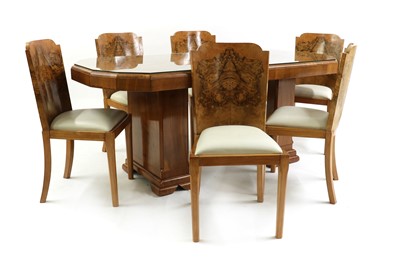 Lot 185 - An Art Deco walnut dining suite