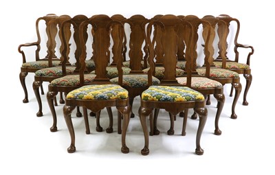 Lot 460 - A set of twelve and two queen Anne style walnut dining chairs