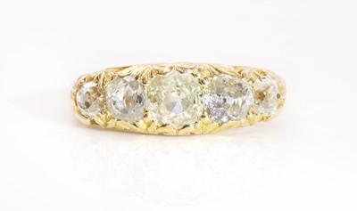 Lot 65 - A late Victorian five stone diamond carved head ring