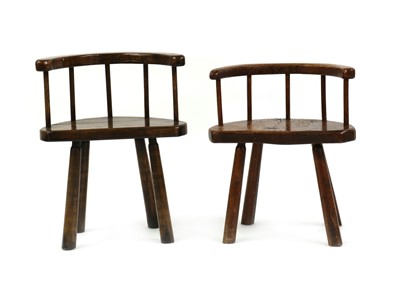 Lot 438 - A near pair of oak stick back chairs