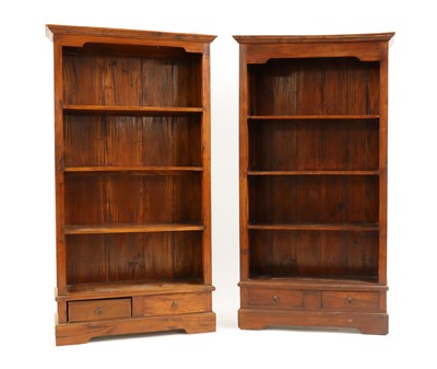 Lot 521 - A pair of hardwood open front bookcases