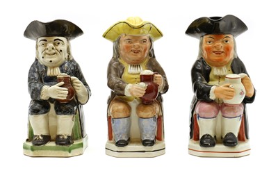Lot 159 - A group of three pottery Toby jugs