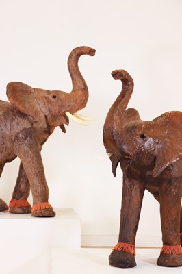 Lot 136 - A near pair of leather elephants