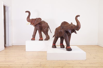 Lot 136 - A near pair of leather elephants