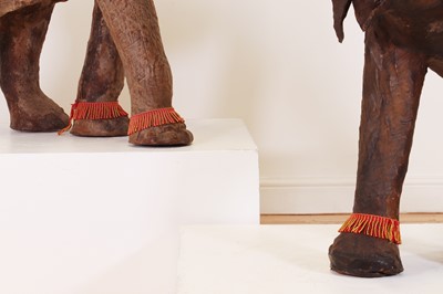 Lot 136 - A near pair of leather elephants
