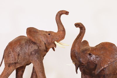 Lot 136 - A near pair of leather elephants