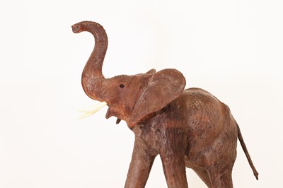 Lot 136 - A near pair of leather elephants