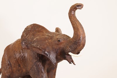 Lot 136 - A near pair of leather elephants