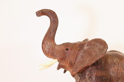 Lot 136 - A near pair of leather elephants