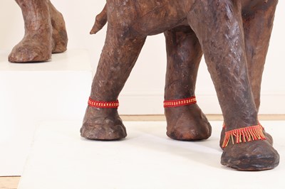 Lot 136 - A near pair of leather elephants