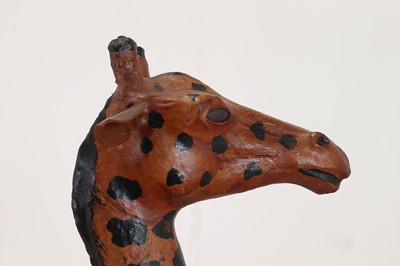 Lot 138 - A pair of painted hide figures of giraffes