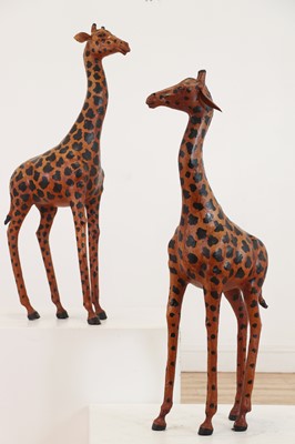Lot 138 - A pair of painted hide figures of giraffes