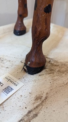 Lot 138 - A pair of painted hide figures of giraffes