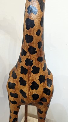 Lot 138 - A pair of painted hide figures of giraffes