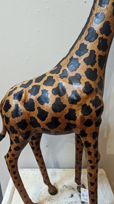Lot 138 - A pair of painted hide figures of giraffes