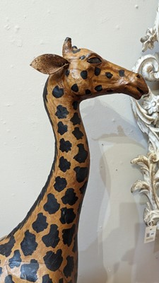 Lot 138 - A pair of painted hide figures of giraffes