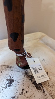 Lot 138 - A pair of painted hide figures of giraffes