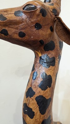 Lot 138 - A pair of painted hide figures of giraffes