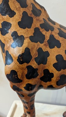 Lot 138 - A pair of painted hide figures of giraffes