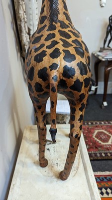Lot 138 - A pair of painted hide figures of giraffes