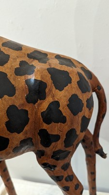 Lot 138 - A pair of painted hide figures of giraffes