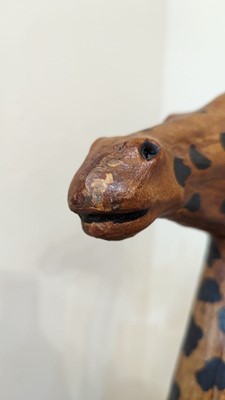 Lot 138 - A pair of painted hide figures of giraffes