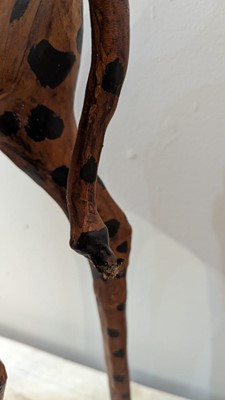 Lot 138 - A pair of painted hide figures of giraffes