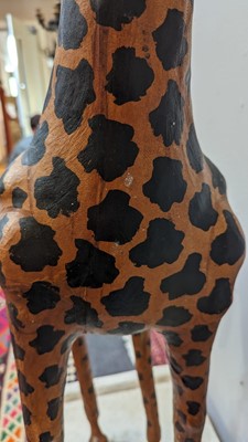 Lot 138 - A pair of painted hide figures of giraffes