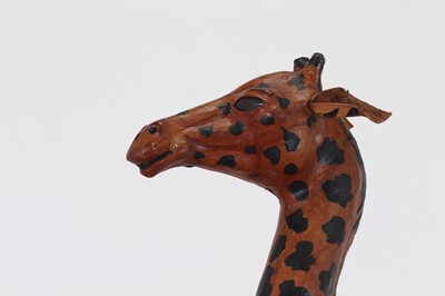 Lot 138 - A pair of painted hide figures of giraffes