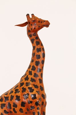 Lot 138 - A pair of painted hide figures of giraffes